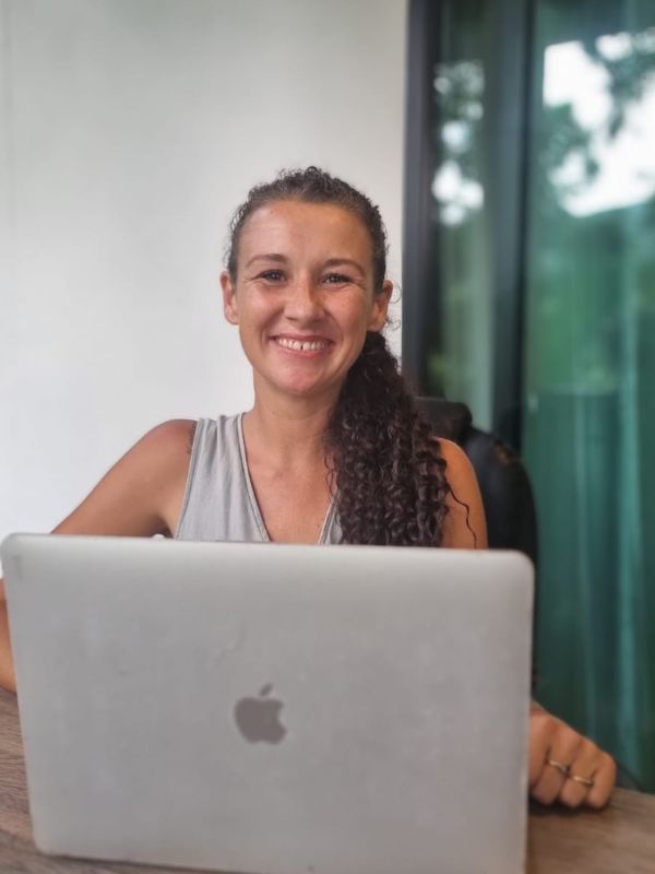 Anna Jefferson, Welsh Klaviyo email marketing and retention strategist for eCommerce and Shopify brands, working on a laptop